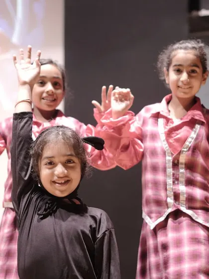 Waving with excitement backstage! The energy and enthusiasm before a show are absolutely contagious.