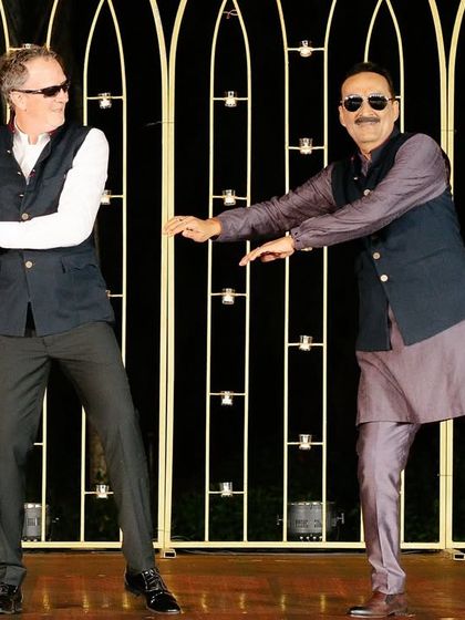 The fathers of the bride and groom showing off their moves together. We love bringing both families together on the dance floor.