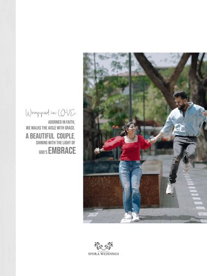 A joyful, energetic shot of the couple jumping in the air, a moment of pure, uninhibited fun.