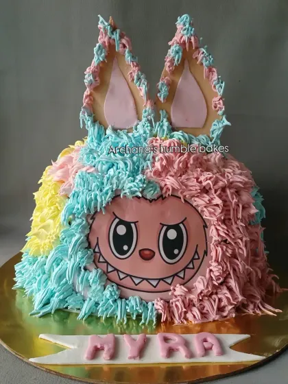 This unique Labubu monster themed cake was so much fun to make. The colorful fur effect is created with buttercream piping.