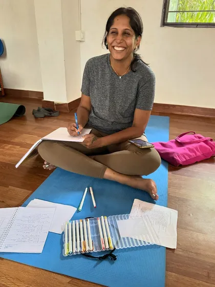 A lighthearted moment during our TTC. Our student Soumya believes using 12 different colors for her notes will help her become a good teacher. We encourage joy in learning.
