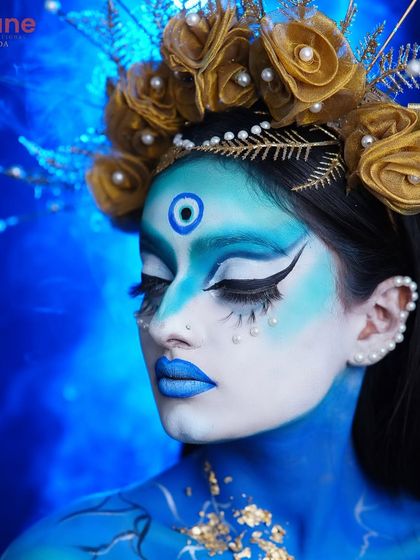 A side profile of the celestial goddess, showing the seamless blend of blue and white body paint and the delicate pearl accents.