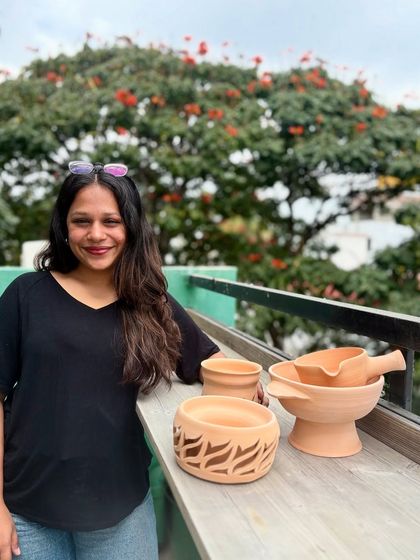 Asmi, our apprentice, with some of her beautiful greenware. Her talent for surface work is a perfect fit for our studio.