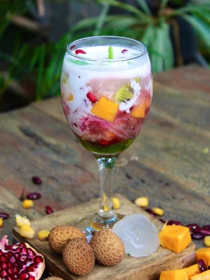 A closer look at our vibrant Ice Kachang, with layers of fruit, beans, and creamy coconut mylk. It's your new summer bestie in a glass.