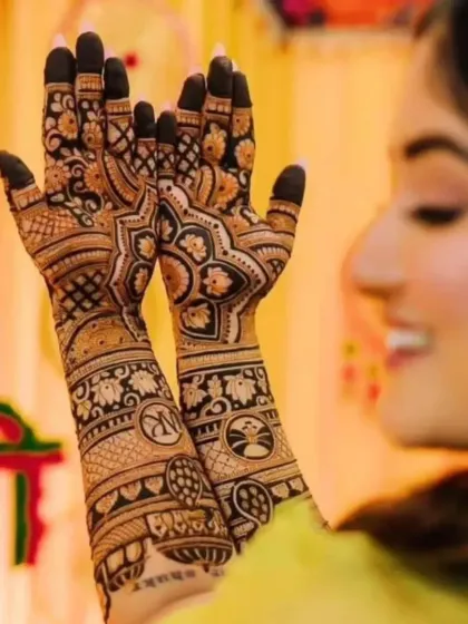 The back of the hands are just as important. This design features the couple's initials inside mandalas, complemented by intricate floral work.