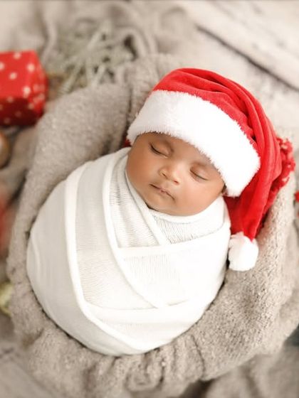 A cute little Santa sleeping in his basket. Newborn Christmas photos are just the sweetest.