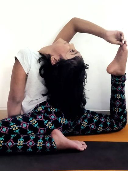 A young practitioner shows beautiful form in a variation of mermaid pose, demonstrating great potential and flexibility.