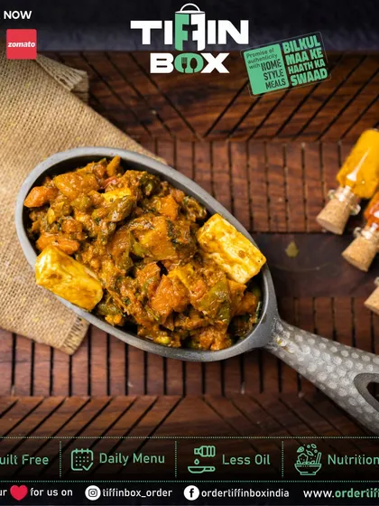 This Kadai Paneer, cooked with bell peppers and aromatic spices, is a true delight. The large scoop shows the rich texture and generous chunks of paneer.