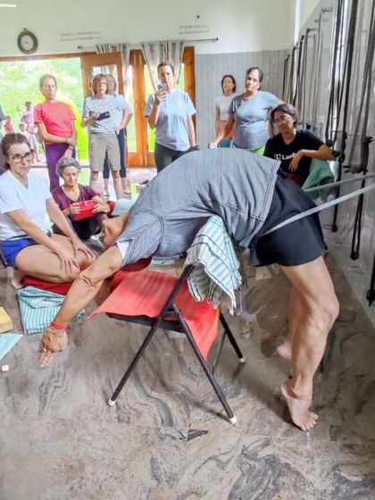 Demonstrating a supported backbend to students.