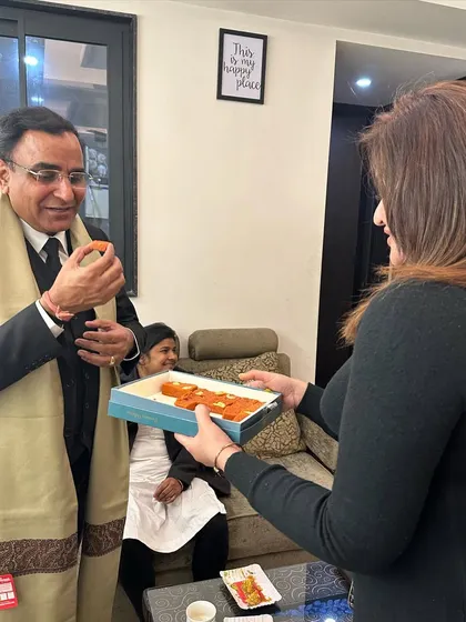 Offering sweets during a meeting with Advocate Sanjeev Chaudhary. It's the small gestures that help build lasting professional relationships.