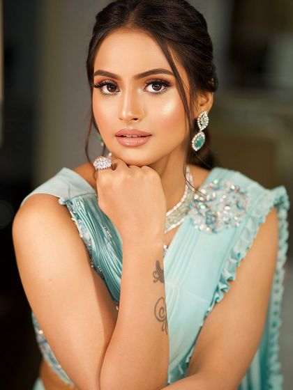 A classic portrait, her makeup looking flawless and her expression confident.