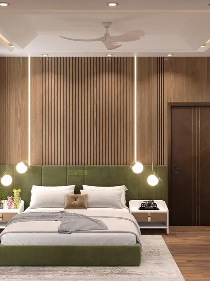 Another view of the master bedroom with wooden paneling. This angle highlights the green upholstered bed, which provides a beautiful color contrast against the warm wood tones.