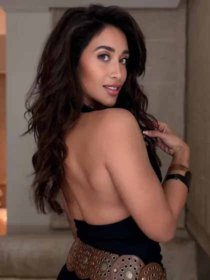 This deep brown two-tone color gives a rich and luxurious feel to long hair. The client's pose shows off the length and healthy shine of her new look.