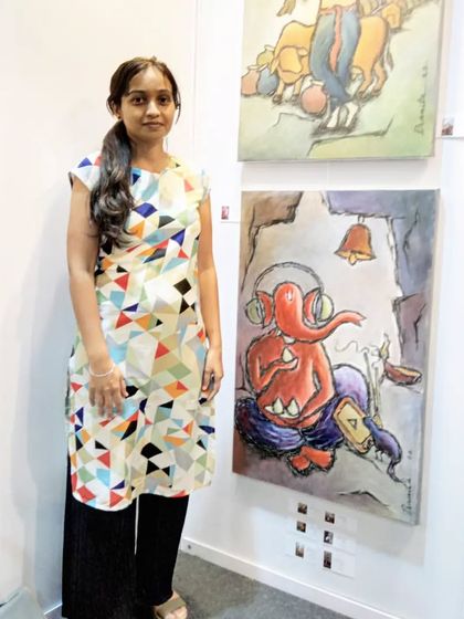Me at my stall during the Mumbai Art Fair '22. I was so happy to exhibit my modern Ganesha painting and a piece from my Krishna series.
