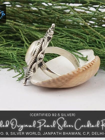 A side view of the coiled pearl cocktail ring, showing its impressive height and three-dimensional structure.