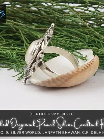 A side view of the coiled pearl cocktail ring, showing its impressive height and three-dimensional structure.