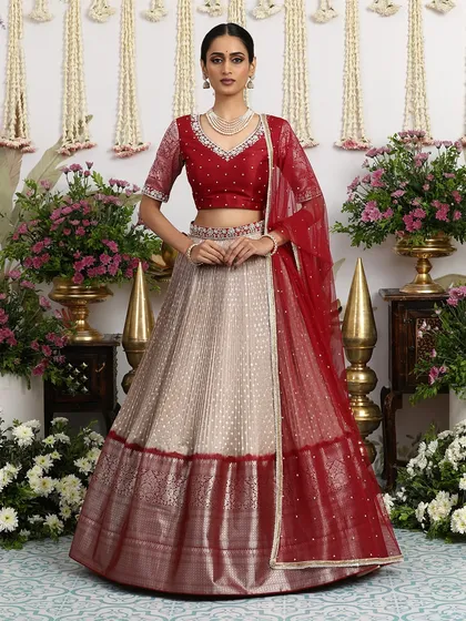 The rich maroon and beige combination is a classic that never goes out of style, making this lehenga a true heirloom piece.