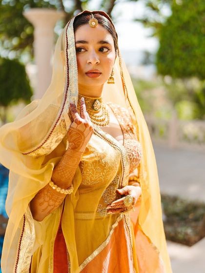 A portrait of Shree with her dupatta veiled over her head, capturing the royal and traditional essence of her Jodhaa Akbar-inspired Haldi look.