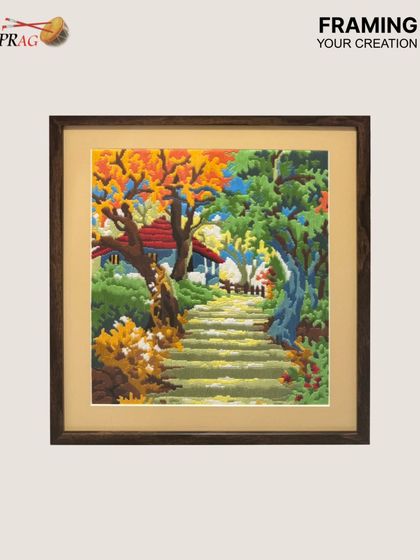A client's own creation, a colorful needlepoint, is given a professional finish with our framing. We chose a warm wood frame and a soft beige mount to complement the artwork's charming, handcrafted feel.