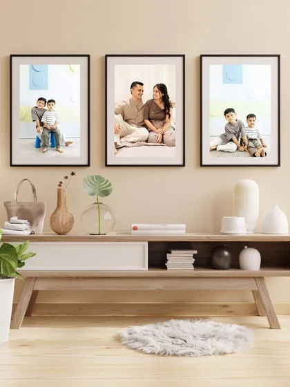 An example of how a series of family portraits can be displayed as a beautiful gallery wall in your home.