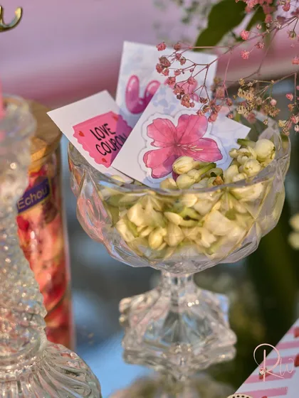 Another angle of the crystal bowl with jasmine and love coupons, a small detail that adds a layer of thoughtfulness to the decor.