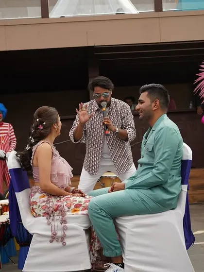 Another shot of me hosting a game with the couple at their carnival party. These personalized segments make the event unique and memorable.