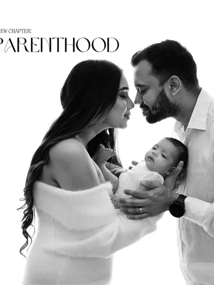 A beautiful black and white image celebrating the start of parenthood. This shot captures the intimacy and love of a new family.