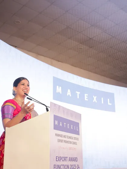 A candid moment of speaking at the MATEXIL event. I balance a formal script with natural delivery to connect authentically with the audience.