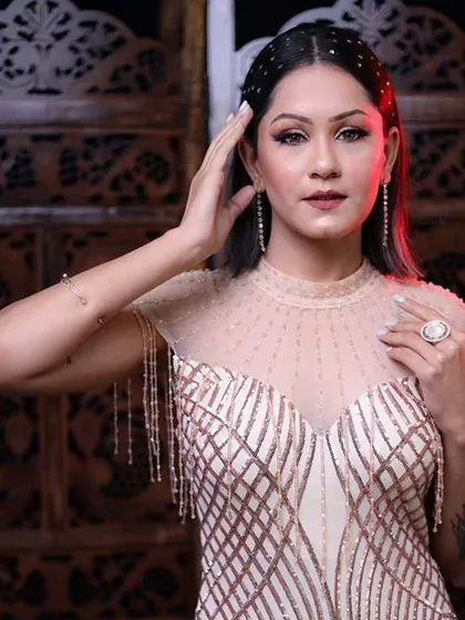 A glamorous party look with a stunning embellished dress. The makeup is kept radiant and glowing to match the sparkle of the outfit.