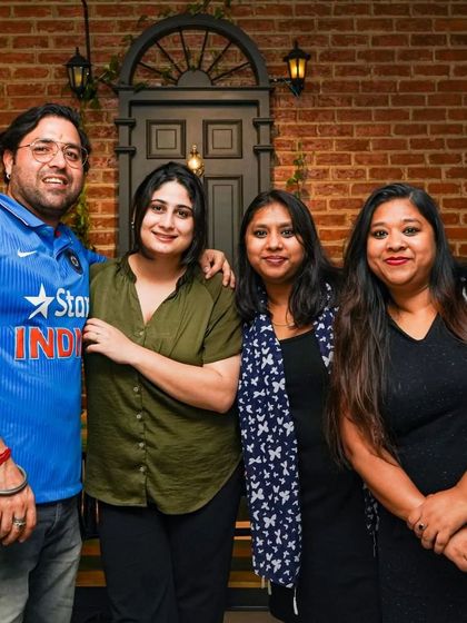 A group of friends, including a fan in his Team India jersey, soaking in the pub's atmosphere. It's a great place for your squad to gather, relax, and make some memories.