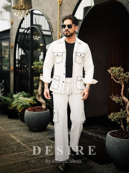 A full-length shot of the all-white co-ord set, showcasing its clean silhouette and the bold statement it makes.