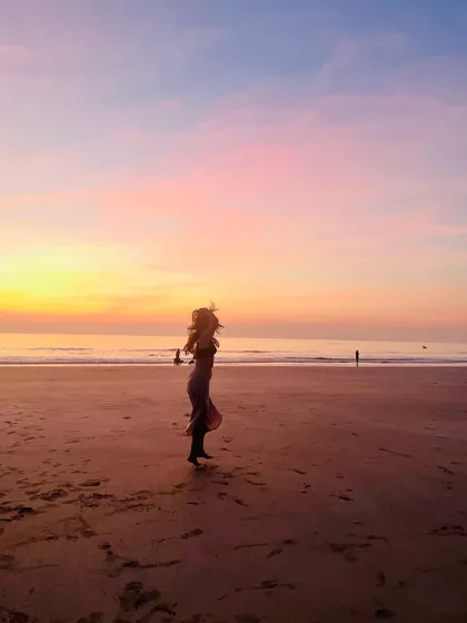 A lesson to take into the new year: Play more. A candid shot from a beach at sunset, reminding me to keep things light and approach life with kindness and a playful heart.