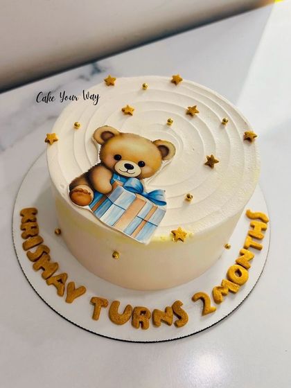 Celebrating a baby's 2-month milestone with an adorable teddy bear bento cake. The cute edible topper and hand-piped lettering make this a sweet keepsake for the special day.
