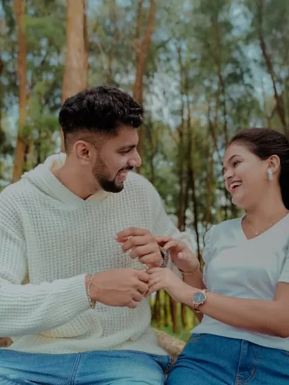 A joyful, candid moment during a pre-wedding shoot in the woods. We focus on capturing genuine laughter and interaction.