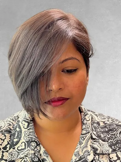 Short hair requires precision and an eye for shape. This asymmetrical pixie-bob is a chic, modern haircut that is both stylish and incredibly easy for the client to manage day to day.