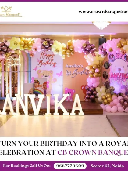 A grand teddy bear themed first birthday. The elaborate balloon arch in pink and gold, complete with cute teddy bear figures, creates a lavish and adorable setting.