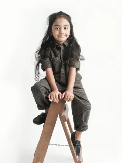 A sweet, simple portrait on the ladder. Her calm expression is a lovely contrast to the more playful shots.