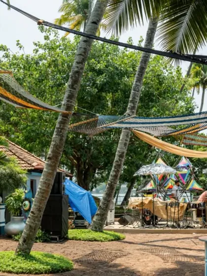 Hammocks strung between palm trees offered a perfect spot for guests to relax and enjoy the view at our lakeside Mehendi festival.