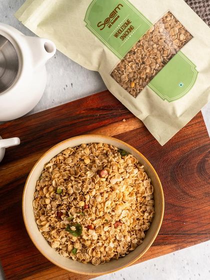 A close-up of my Bajra Flakes Chivda in a glass jar. This snack is not only delicious but also rich in fiber, gluten-free, and supports heart health.