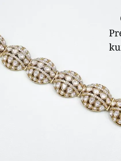 A premium quality Kundan bracelet with a unique, domed design. This classic all-white stone version is elegant and versatile.