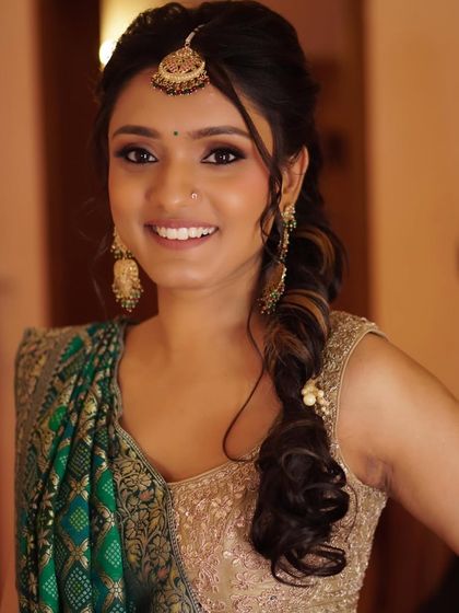 The joy of a Mehendi ceremony is captured in this beautiful, smiling portrait of Nony. Her makeup is natural and radiant, allowing her happiness to be the main focus.