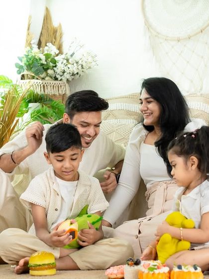 A playful, candid moment with the whole family. These unposed shots, filled with laughter and interaction, are often the most cherished.