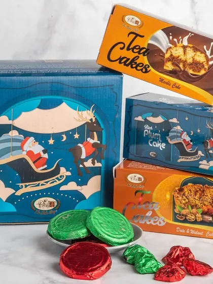 The 'Cozy Christmas Comfort' hamper is a feast in a box, with plum cake, tea cakes, chocolate biscuits, and assorted rocks.