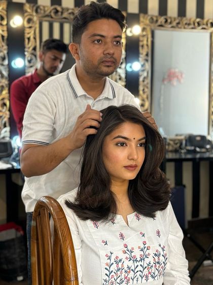 A close up of the blow dry curls demonstration. Notice the volume at the roots and the smooth finish on the ends, a technique we practice thoroughly in class.