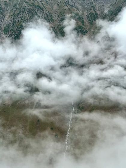 A view from above the clouds, with a river snaking through the valley below. On this trek, you literally get to walk in the sky.