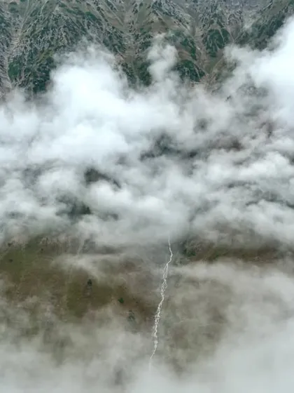 A view from above the clouds, with a river snaking through the valley below. On this trek, you literally get to walk in the sky.