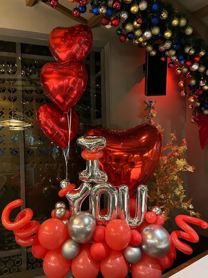 A classic red and silver "I Love You" balloon bouquet I set up for a Valentine's Day celebration. The mix of foil and latex balloons creates a dynamic and festive look.