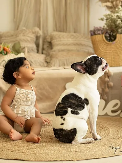Yes, your furry family members are always welcome! Capturing the sweet, curious bond between a child and their pet adds such a warm and personal touch to our session.