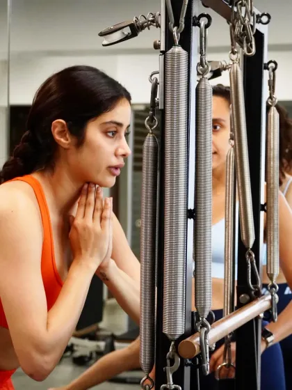 The Cadillac is one of the most versatile pieces of Pilates equipment, allowing for a full range of movements that build strength, flexibility, and control. Here, Janhvi Kapoor demonstrates deep focus and precision, working against the spring resistance to tone and align her body.