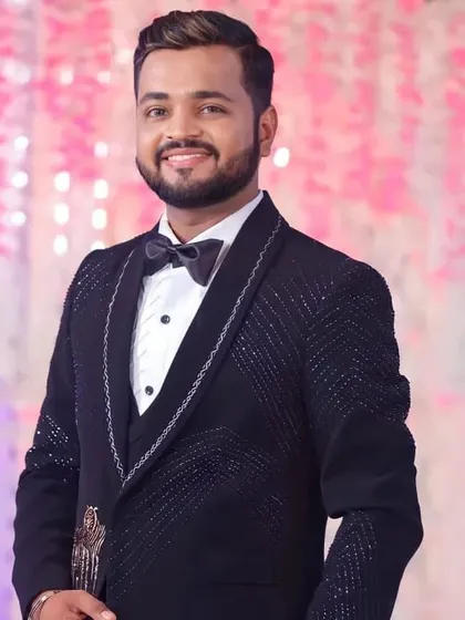 This groom is all smiles at his reception. The makeup is natural yet effective, giving him a fresh and polished look for the party.